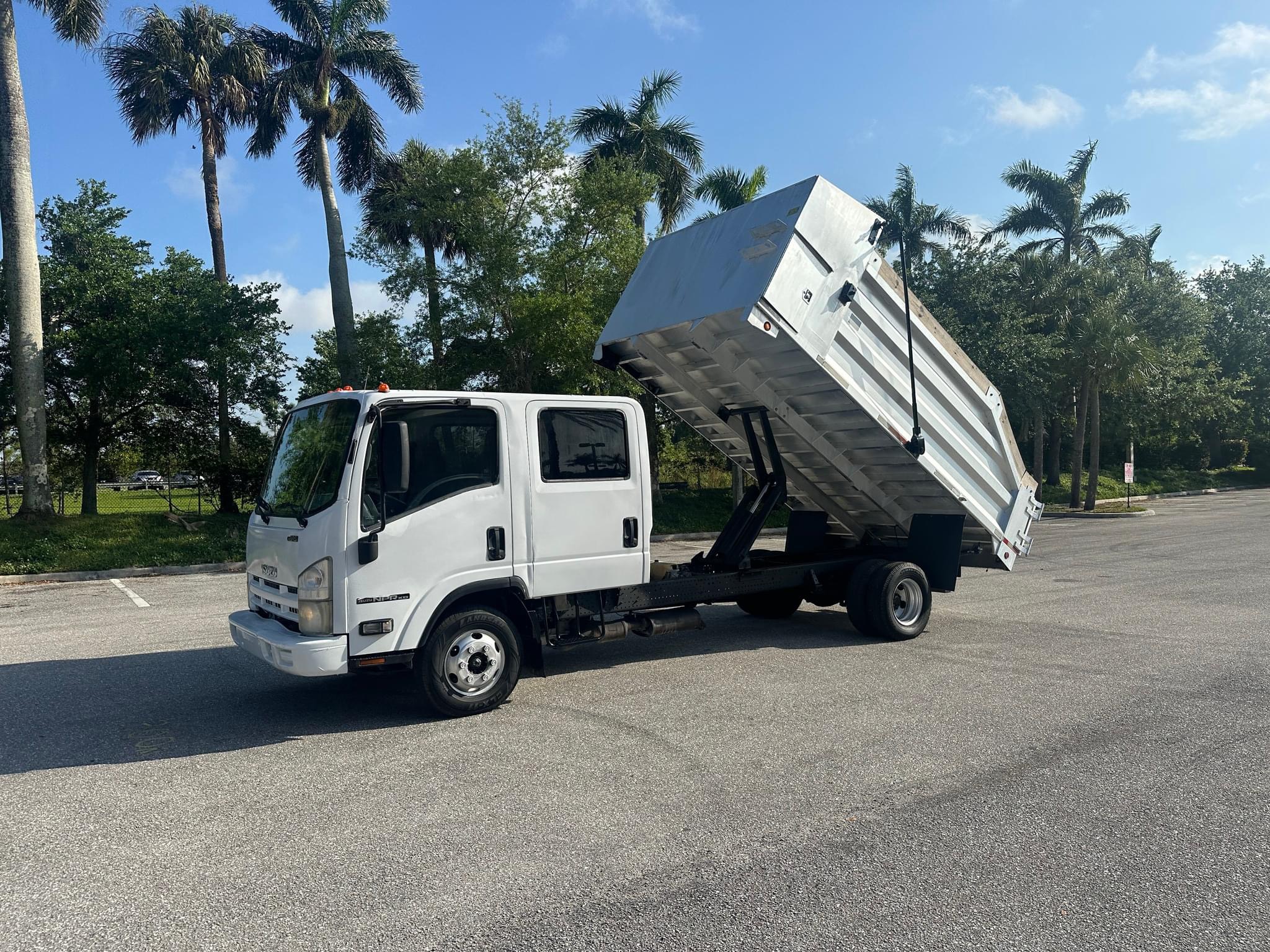 Available now 2012 Isuzu NPR Crew Cab Dump Truck V8 Gas Aluminum Dump Truck in West Palm Beach FL, 33411